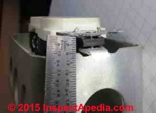 Electrical box stripped screw repair Metal Box Mender U.K. (C) Daniel Friedman
