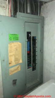 Murray electrical panel showing red and blue circuit breaker toggle switches (C) InspectApedia.com SHB
