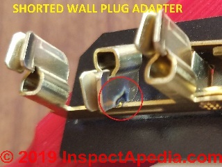 Shorted wall plug adapter caused circuit breakter trip: don't wiggle your plugs (C) Daniel Friedman at InspectApedia.com