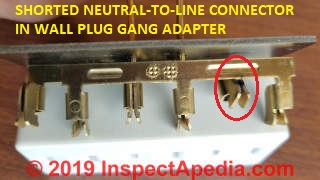 Un-grounded wall plug adapter / gang adapter found to be shorted internally, tripped circuit breaker (C) Daniel Friedman at InspectApedia.com