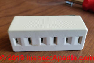 Un-grounded wall plug adapter / gang adapter found to be shorted internally, tripped circuit breaker (C) Daniel Friedman at InspectApedia.com