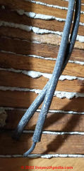 Decommissioned single conductor in stiff rubber insulation (C) InspectApedia.com Jay