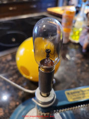 Find replacement bulb (two pin bayonet base) for a 1970s classroom solar system model (C) Inspectapedia.com Tim Martin