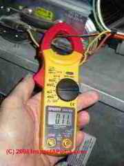 Sperry Digisnap clamp on ammeter digital VOM measuring current draw at a furnace (C) Daniel Friedman