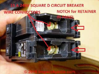 Square D circuit breaker showing the retainer notch molded into the breaker body and the circuit wire connectors (C) Daniel Friedman at InspectApedia.com