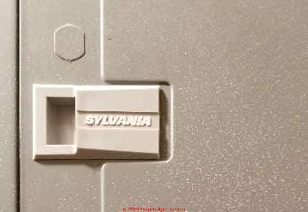 Sylvania electrical panel door latch bearing the Sylvania name (C) InspectApedia.com  rose