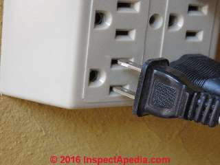 Proper wall plug insertion into a gang adapter (C) Daniel Friedman