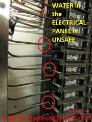 Water droplets on wiring in an electrical panel (C) InspectApedia.com DovBer Kahn