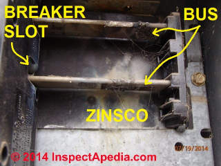 Photo of ZInsco electric panel bus bars with arc-burn damage (C) InspectApedia.com Tim Hemm