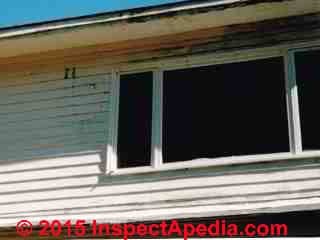 Brown leak stains coming out of clapboard siding (C) InspectApedia.com Daniel Friedman