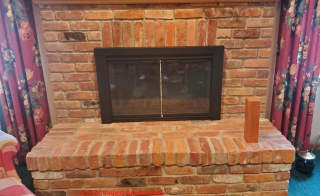 Lower level brick fireplace (C) InspectApedia.com George