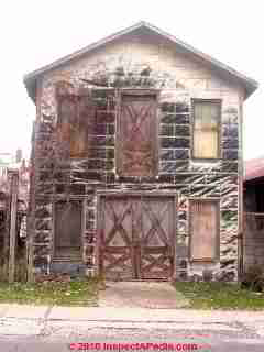 Damaged asphalt siding (C) Daniel Friedman