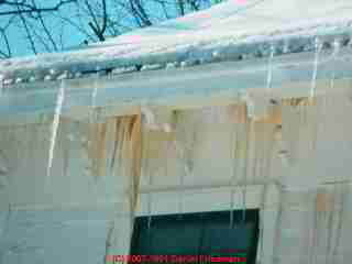 Photograph of severe ice dam leaks on an older home.