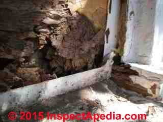 Porch-wall abutment flashing leaks, rot, termites, mold attack (C) Daniel Friedman at InspectApedia.com