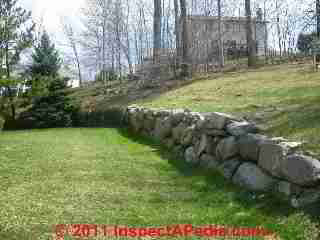 Stone retaining wall © D Friedman at InspectApedia.com 