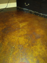 Unwanted light areas in stained concrete flooring (C) InspectApedia.com a