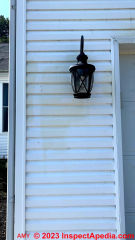 Brown tan stains on vinyl siding (C) InspectApedia.com Amy