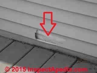 Broken vinyl siding risks leaks into the structure (C) Daniel Friedman