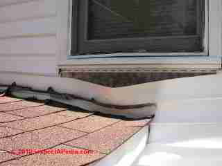 Damaged vinyl siding (C) Daniel Friedman