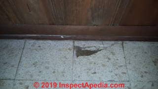 Spatter pattern floor tiles probably contain asbestos - 1960s 1970s (C) InspectApedia.com Zach