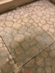 Asbestos likely in this 1950s stone / marble type flooring (C) InspectApedia.com RhondaC