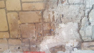 Asbestos in this white brick pattern vinyl flooring (C) InspectApedia.com Drew