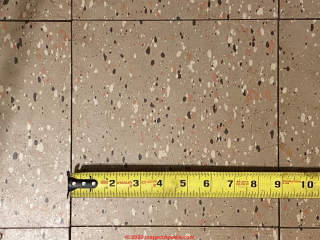 Gray spatter pattern asphalt asbestos or vinul asbestos floor tile (C) InspectApedia.com Beth