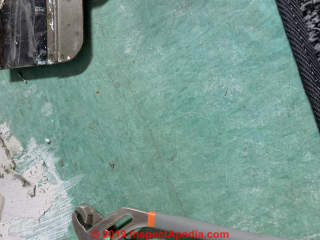 Green asbestos floor tiles (C) InspectApedia.com