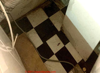 black and white asphalt- or vinyl-asbestos floor tiles from 1960s (C) InspectApedia.com Jen