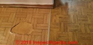 Parquet pattern vinyl sheet flooring from 1980 may contain asbestos (C) InspectApedia.com Vernonica
