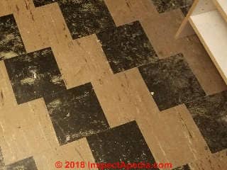 Black and white asbestos-containing floor tiles (C) InspectApedia.com