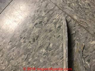 Asbestos-suspect floor tile, 12x12 (C) Inspectapedia.com Scott Schmidt