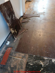 Asbestos likely in these dark brown UK floor tiles (C) InspectApedia.com D Bamford