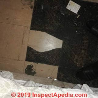 Abestos suspect floor tile in the UK (C) InspectApedia.com Ashley