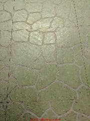 Embossed green stone pattern floor tile from a 1968 home, probably early 1970s treat as PACM (C) InspectApedia.com Zach
