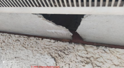Asbestos cement board soffit (C) InspectApedia.com Daniel