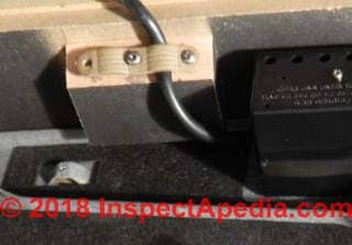 Plastic cable clamp used in the Netherlands - does it contain asbestos ? (C) InspectApedia.com