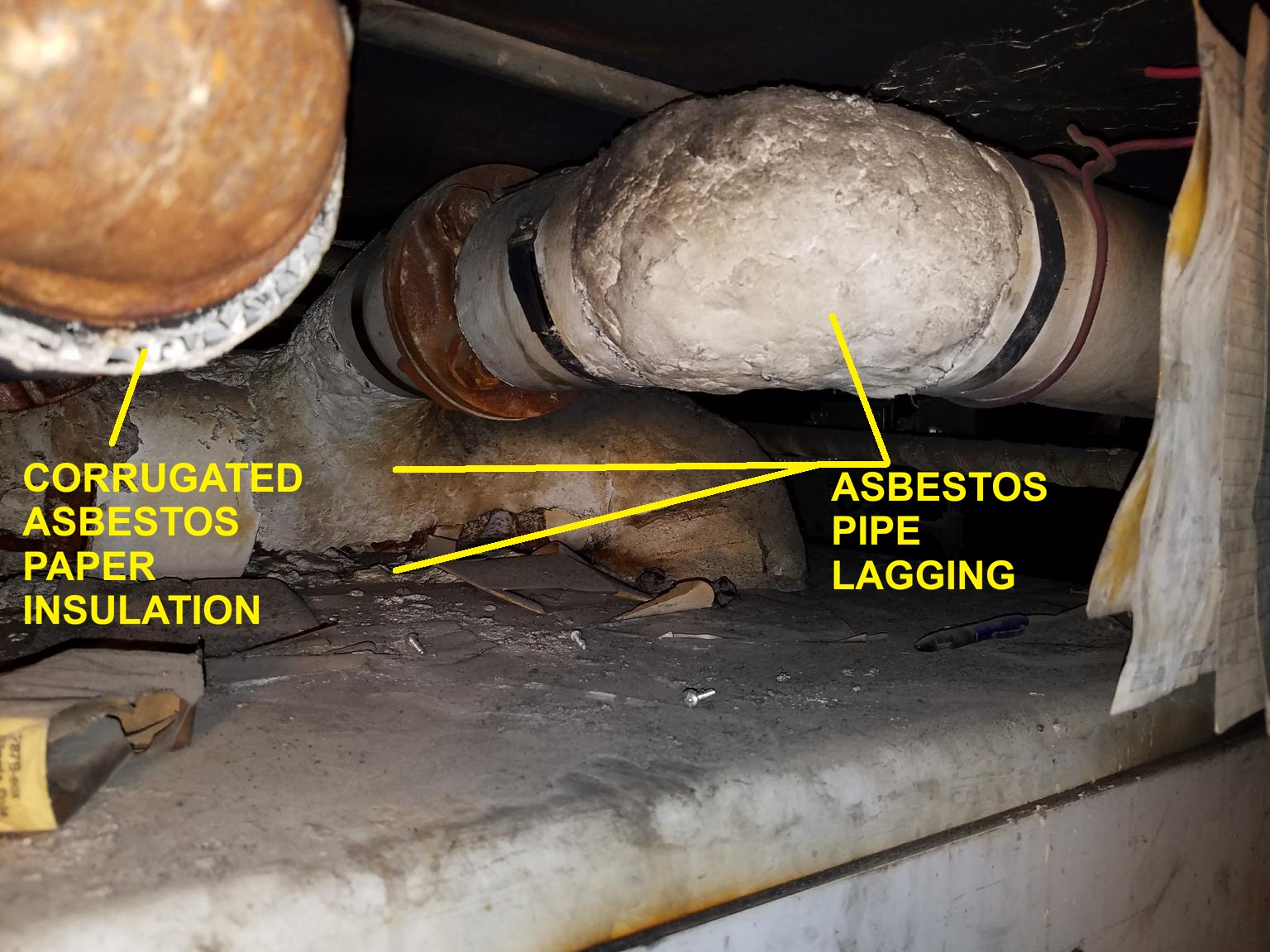 Asbestos lagging on pipe elbow (C) InspectApedia.com Jessy
