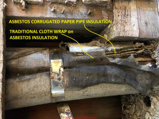 Cloth-wrapped corrugated asbestos paper pipe insulation on a bathroom drain (C) InspectApedia.com JayB