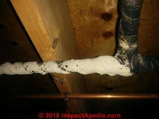 Asbestos-suspect spiral wrap on a copper water pipe (C) InspectApedia.com Dan