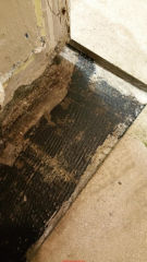 Asbestos-suspect floor tile & mastic (C) InspectApedia.com Marz