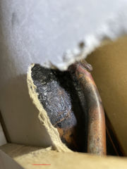 solder or brazing and heat an burn marks in a wall cavity of an Australian building where asbestos may have been used as a heat shield during plumbing work (C) In spectApedia.com Alex