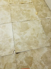 White backer vinyl floor tile with apparent fiberglass might still contain asbestos - more research needed (C) InspectApedia.com Dave
