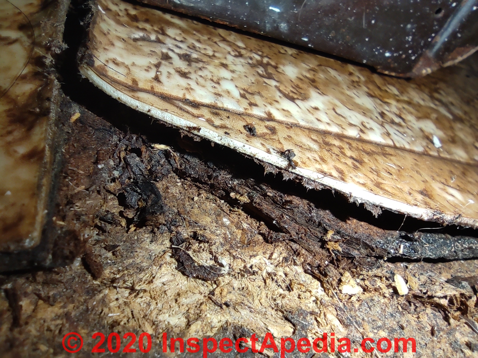 Asbestos-suspect flooring in a 1980s Australian home (C) InspectApedia.com Sheet