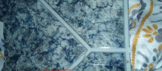 Blue pattern flooring (C) InspectApedia.com Kim