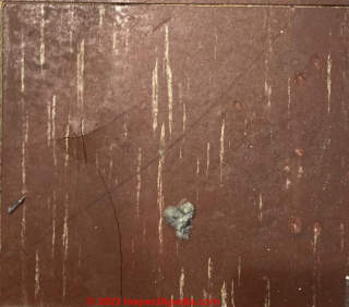 brown asbestos floor tile 1970s (C) InspectApedia.com Rob