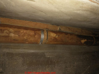 Unidentified brown pipe insulation in London, U.K. (C) Inspectapedia.com Joe