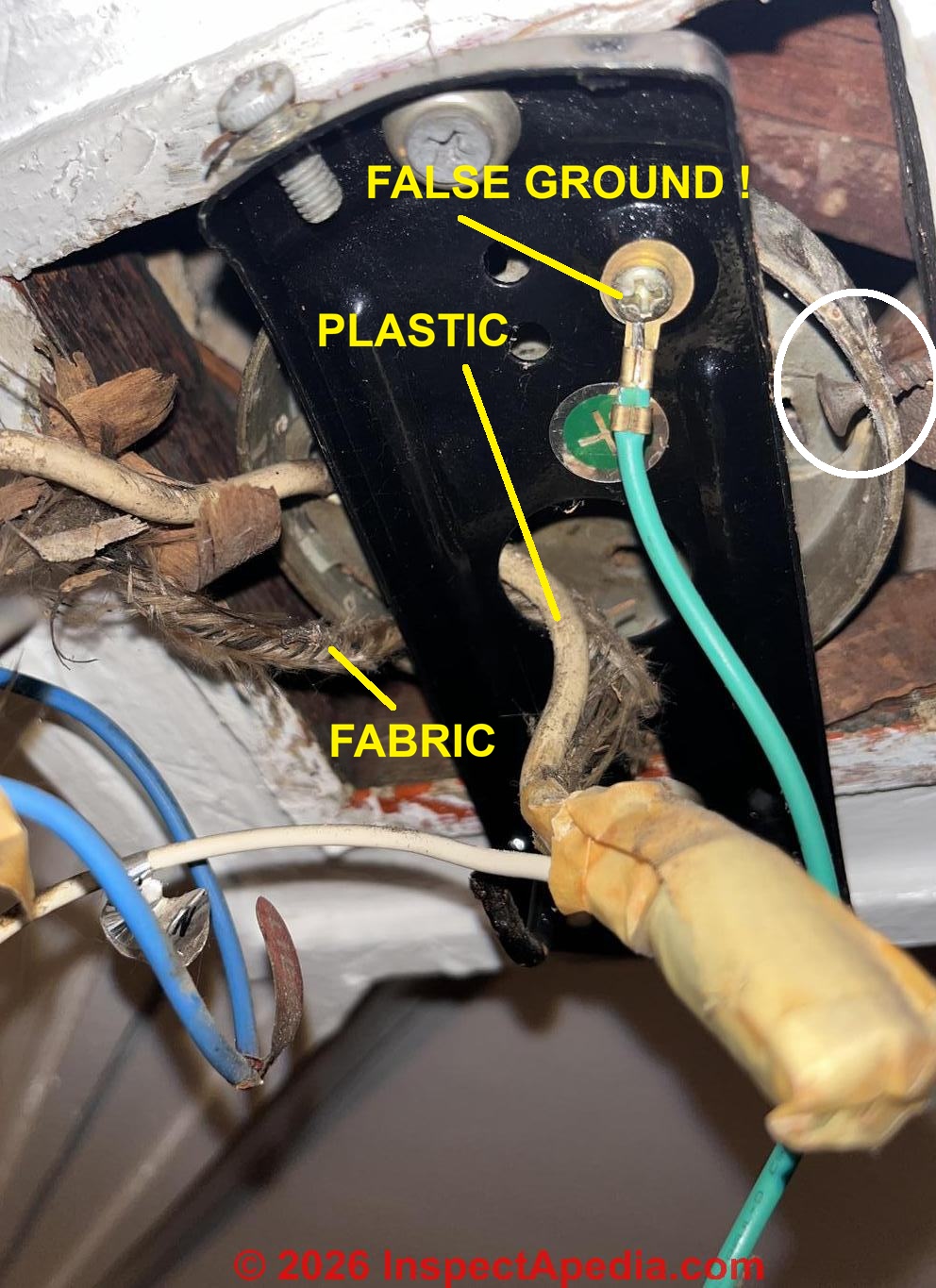 Light fixture electrical wire asbestos in a 1906 home? (C) InspectApedia.com Jen