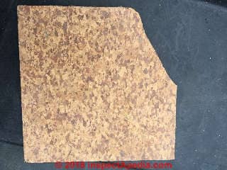 Cork pattern vinyl asbestos flooring 9x9" probably contains asbestos (C) InspectApedia.com NS