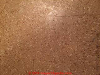 Cork pattern vinyl floor tile may contain asbestos (C) InspectApedia.com Scott